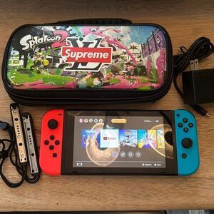 Nintendo switch handheld game with charger and case